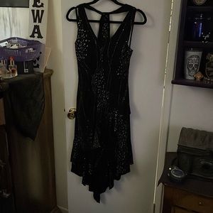 Cute sparkly dress goes a little above the knee, size small.